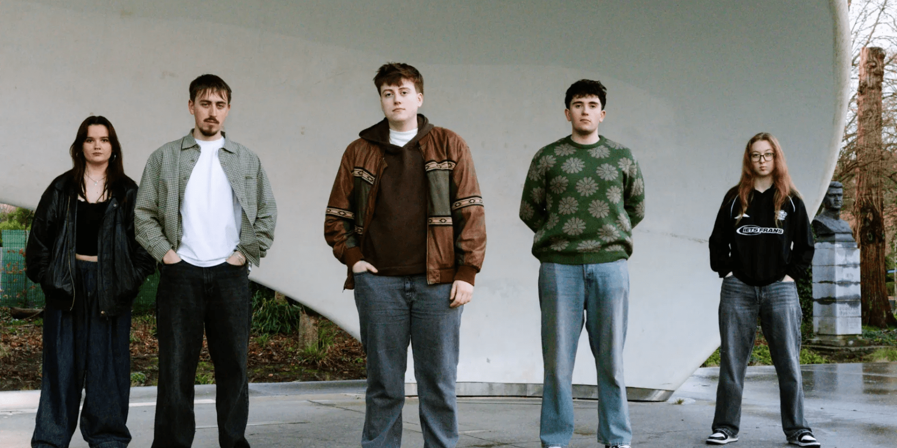 MDR band members standing together in casual clothing group photo